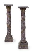 A PAIR OF VARIEGATED RED AND GREEN MARBLE AND GILT BRONZE MOUNTED PEDESTAL COLUMNS