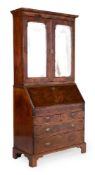 A GEORGE II WALNUT, BURR WALNUT, BURR YEW AND FEATHER BANDED BUREAU BOOKCASE, CIRCA 1735