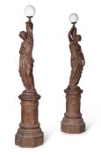 A LARGE PAIR OF CAST IRON FEMALE FIGURAL LIGHTS ON PEDESTALS, LATE 19TH CENTURY
