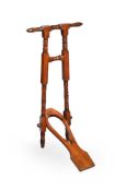 AN EDWARDIAN WALNUT BOOTJACK, EARLY 20TH CENTURY