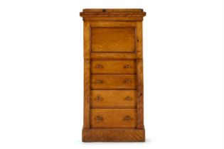 A VICTORIAN SATINBIRCH PEDESTAL 'WELLINGTON' CABINET, MID 19TH CENTURY