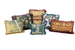 A GROUP OF SIX VARIOUS TAPESTRY CUSHIONS, SOME INCORPORATING EARLIER TAPESTRY PANELS