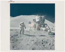 [Apollo 15] JAMES IRWIN SALUTES BESIDE THE U.S. FLAG, LUNAR MODULE AND THE FIRST LUNAR ROVER