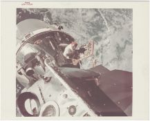 [Apollo 9] OUTER-SPACE VIEW OF DAVID SCOTT PHOTOGRAPHING FROM THE SPACECRAFT HATCH