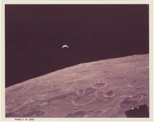 [Apollo 12] CRESCENT EARTHRISE FROM LUNAR MODULE INTREPID DESCENDING TO THE LUNAR SURFACE