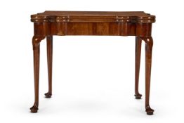 A GEORGE II WALNUT GAMES TABLE, CIRCA 1730