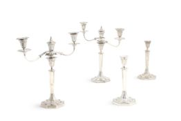 A PAIR OF GEORGE III SILVER CANDELABRA AND A PAIR OF CANDLESTICKS