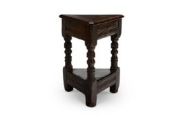 A CHARLES II OAK TRIANGULAR JOINED STOOL OR STAND, CIRCA 1670