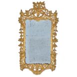 A GEORGE III CARVED GILTWOOD MIRROR, CIRCA 1760