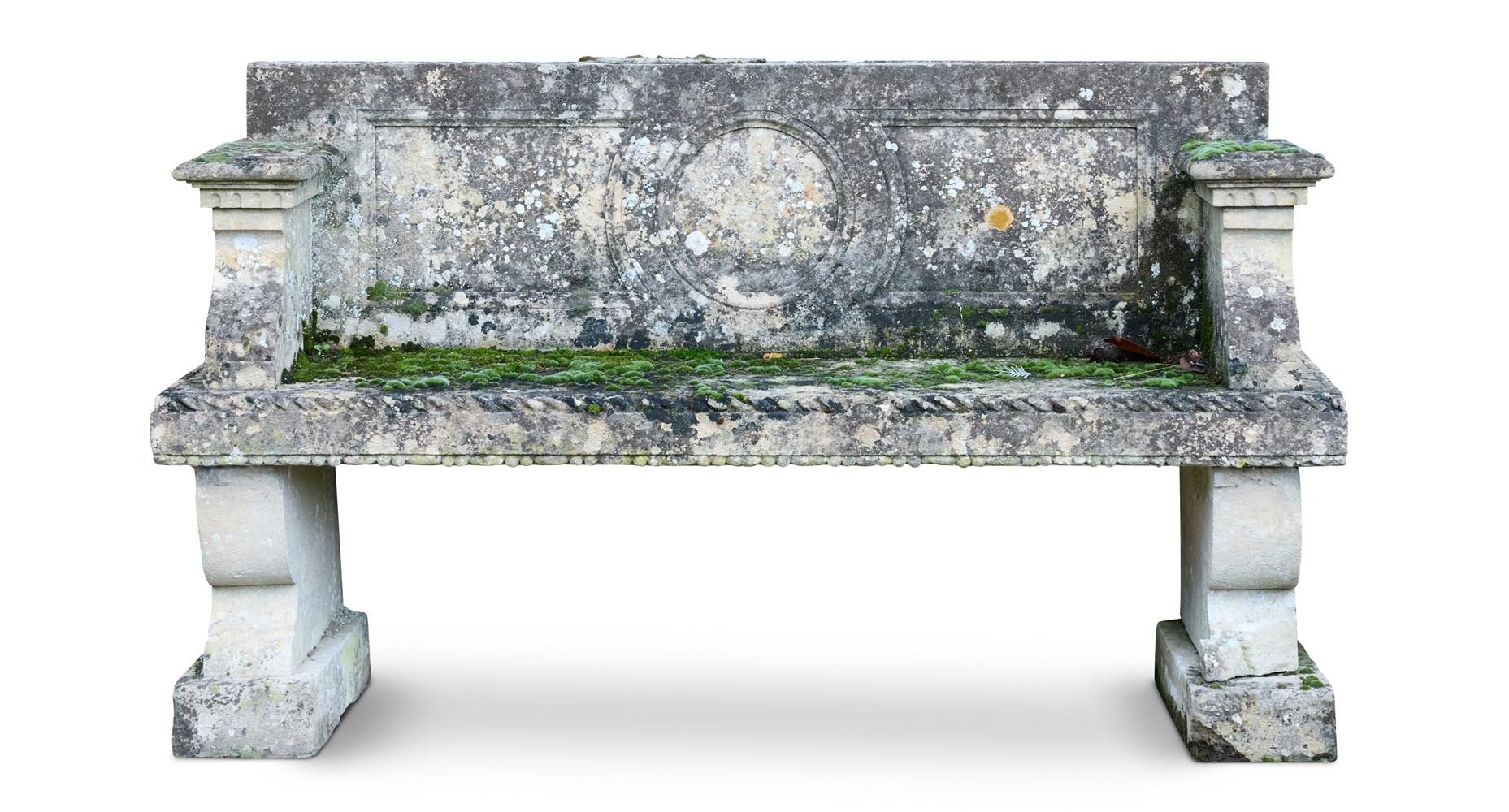 A CARVED LIMESTONE GARDEN BENCH, PROBABLY ITALIAN