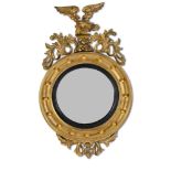 A REGENCY GILTWOOD CONVEX MIRROR, EARLY 19TH CENTURY