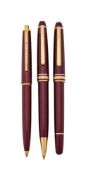 MONTBLANC, MEISTERSTÜCK, A BURGUNDY ROLLERBALL PEN AND TWO PROPELLING PENCILS