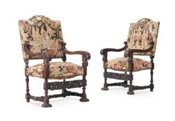 A PAIR OF LOUIS XIV CARVED WALNUT AND NEEDLEWORK UPHOLSTERED ARMCHAIRS