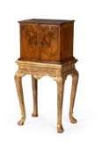 A GEORGE I FIGURED WALNUT AND CROSSBANDED CABINET, CIRCA 1720