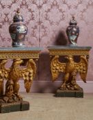 A PAIR OF CARVED GILTWOOD AND MARBLE TOPPED EAGLE CONSOLE TABLES, IN THE MANNER OF WILLIAM KENT