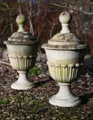 A PAIR OF COMPOSITION STONE CLASSICAL URN FORM GATEPOST FINIALS, LATE 20TH CENTURY