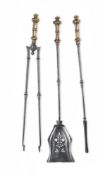 A SET OF THREE BRASS HANDLED POLISHED STEEL FIRE TOOLS, CIRCA 1830-1850