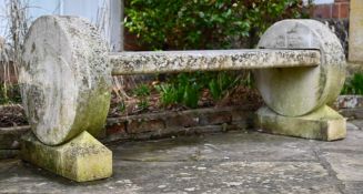 A CARVED STONE ROUNDEL END GARDEN BENCH, 20TH CENTURY