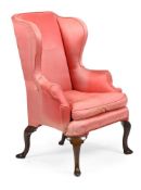 A QUEEN ANNE WALNUT AND UPHOLSTERED WING ARMCHAIR, CIRCA 1710