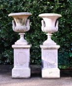 A PAIR OF TERRACOTTA CAMPANA URNS ON PEDESTALS, ATTRIBUTED TO PULHAM, LATE 19TH CENTURY