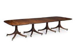 A GEORGE III MAHOGANY FOUR PILLAR EXTENDING DINING TABLE, CIRCA 1790