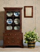 A GEORGE I WALNUT AND BURR WALNUT CABINET ON CHEST, CIRCA 1720