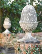 A PAIR OF COMPOSITION STONE ACORN GATEPOST FINIALS, 20TH CENTURY