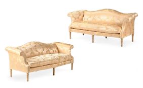 A CLOSELY MATCHED PAIR OF CARVED GILTWOOD AND SILK DAMASK UPHOLSTERED SETTEES, IN GEORGE III STYLE