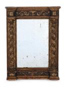 AN ITALIAN CARVED GILTWOOD AND GREEN PAINTED MIRROR, FIRST HALF 18TH CENTURY