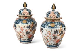 A PAIR OF JAPANESE IMARI VASES AND COVERS, 19TH CENTURY