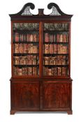 A GEORGE III MAHOGANY LIBRARY BOOKCASE, IN THE MANNER OF THOMAS CHIPPENDALE, CIRCA 1770