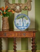 A WILLIAM III DELFT CHARGER 'ADAM AND EVE', CIRCA 1700