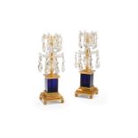 A PAIR OF GEORGE III GILT BRONZE, CUT CLEAR AND BLUE GLASS CANDLESTICKS, CIRCA 1800