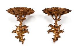 A PAIR OF GEORGE III CARVED GILTWOOD WALL BRACKETS, AFTER DESIGNS BY THOMAS CHIPPENDALE, CIRCA 1760