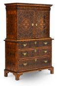 OF ROYAL PROVENANCE, A FINE QUEEN ANNE OLIVEWOOD OYSTER, HOLLY AND WALNUT CABINET ON CHEST
