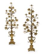 A LARGE PAIR OF CONTINENTAL GILT BRASS AND WHITE GLASS MOUNTED EIGHT LIGHT CANDELABRA
