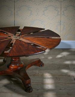 A WILLIAM IV MAHOGANY EXTENDING DINING TABLE, BY JOHNSTONE, JUPE & CO., CIRCA 1835