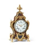 AN UNUSUAL LOUIS XVI GILT BRASS MOUNTED EMBOSSED LEATHER COVERED BRACKET CLOCK