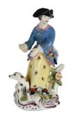 A BOW PORCELAIN MODEL OF A SPORTSWOMAN, MID 18TH CENTURY
