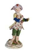 A BOW PORCELAIN MODEL OF A BOY EMBLEMATIC OF AUTUMN FROM A SERIES OF THE FOUR SEASONS, CIRCA 1765