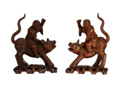 A LARGE PAIR OF CARVED WOOD LOHANS RIDING TIGERS, LATE 19TH OR EARLY 20TH CENTURY