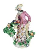 A BOW PORCELAIN MODEL OF A 'FLOWER GIRL', CIRCA 1760