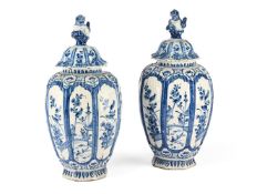 A PAIR OF DUTCH DELFT BLUE AND WHITE OCTAGONAL SECTION VASES AND COVERS, LATE 19TH CENTURY