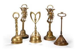 A GROUP OF FIVE BRASS DOOR PORTERS OR DOOR STOPS, LATE 19TH AND 20TH CENTURY
