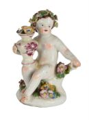 A BOW PORCELAIN MODEL OF A PUTTO, MID 18TH CENTURY