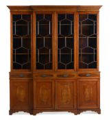 Y AN EDWARDIAN MAHOGANY, SATINWOOD AND EBONY STRUNG BREAKFRONT BOOKCASE, EARLY 20TH CENTURY AND LATE