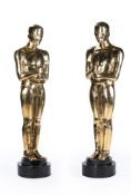 AFTER CEDRIC GIBBONS; A LARGE PAIR OF GILT BRASS FLOOR STANDING 'OSCAR' STATUES, CONTEMPORARY