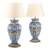 A PAIR OF DUTCH DELFT POLYCHROME OVOID AND GADROONED VASES, LATE 19TH OR EARLY 20TH CENTURY