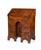 A WILLIAM III FIGURED WALNUT KNEEHOLE BUREAU, CIRCA 1700