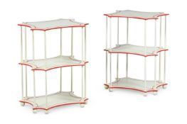 A PAIR OF THREE TIER IVORY PAINTED ETAGERE TABLES, POSSIBLY SUPPLIED BY COLEFAX & FOWLER